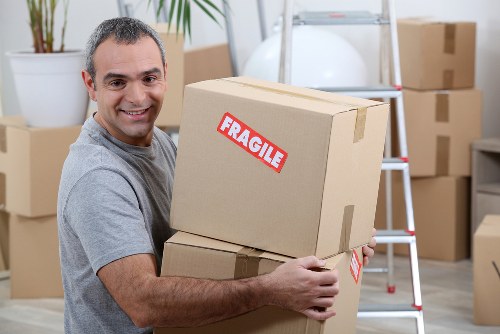 Removal van and moving team preparing a Kew home move