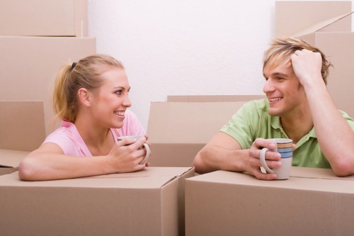 Packed boxes and furniture prepared for transport in Kew
