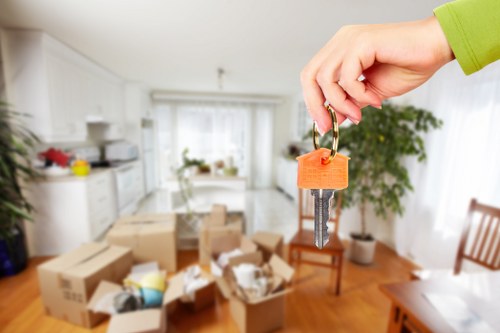 Careful loading of sofas, tables, and office furniture in Kew
