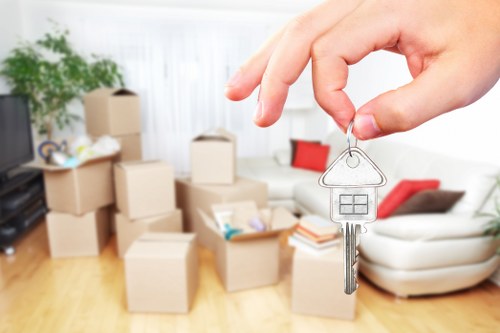 Trained staff handling boxes with care during a move