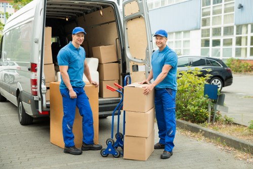 Professional moving truck service helping with furniture delivery in Kew