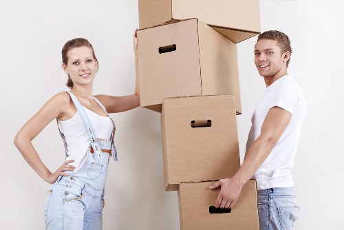 Man and van carrying items through a Kew property